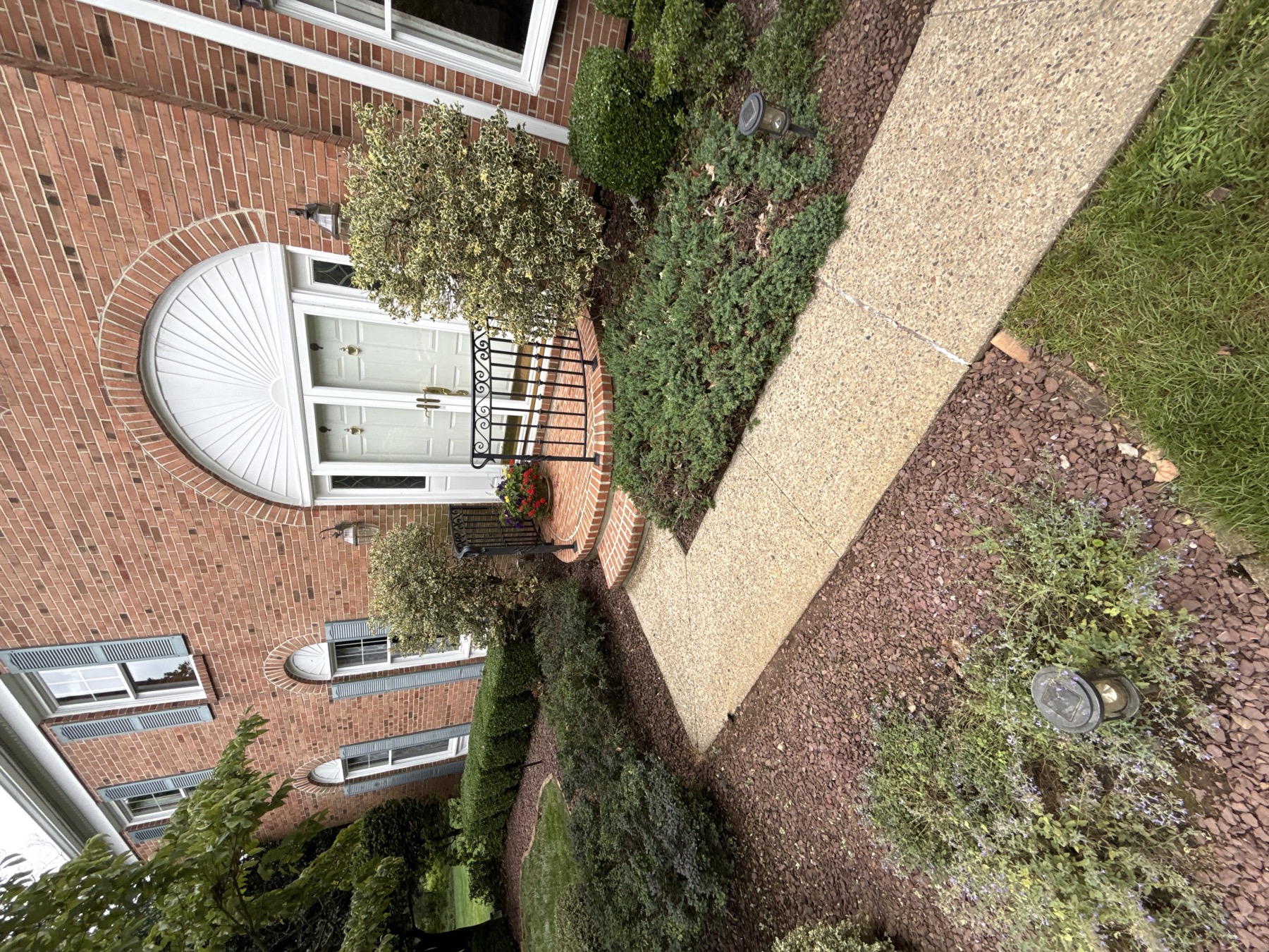 Clean brick entry and walkway after pressure washing